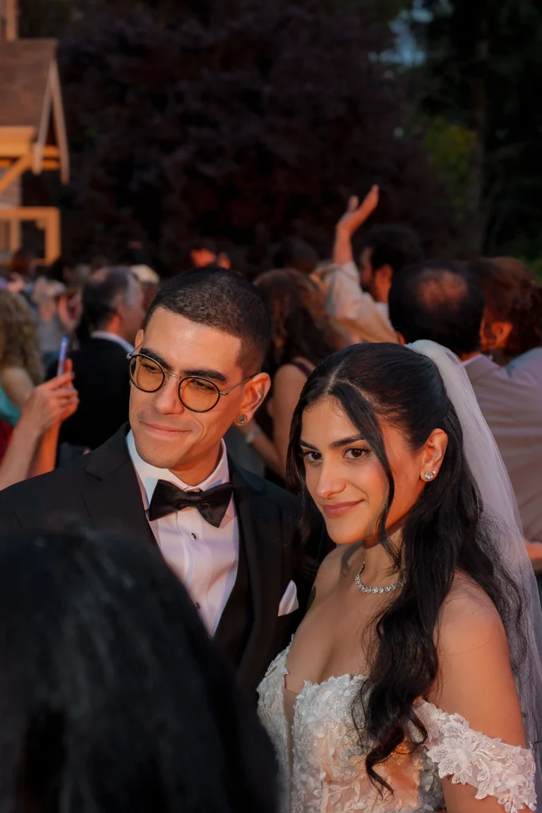 Bride and groom enjoying a candid moment during their wedding reception