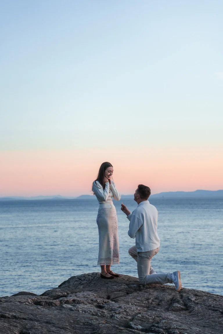 Romantic oceanfront marriage proposal during sunset